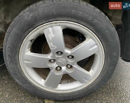 Черный Мицубиси Аутлендер, объемом двигателя 2 л и пробегом 306 тыс. км за 6500 $, фото 16 на Automoto.ua