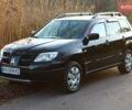 Черный Мицубиси Аутлендер, объемом двигателя 2 л и пробегом 189 тыс. км за 7200 $, фото 2 на Automoto.ua