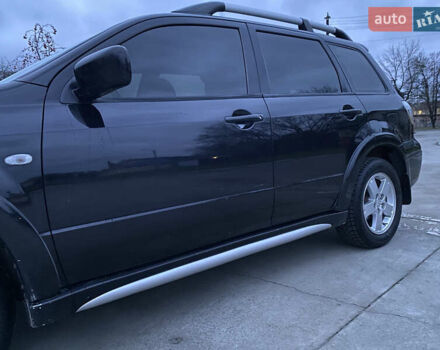 Чорний Міцубісі Аутлендер, об'ємом двигуна 2 л та пробігом 271 тис. км за 6799 $, фото 2 на Automoto.ua