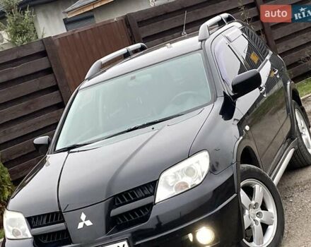 Черный Мицубиси Аутлендер, объемом двигателя 2.4 л и пробегом 178 тыс. км за 6900 $, фото 6 на Automoto.ua