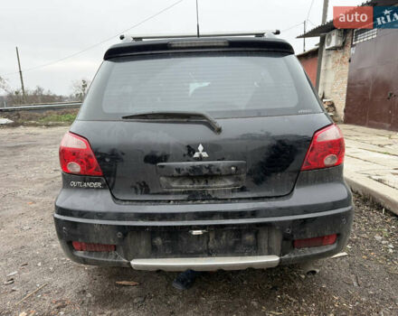 Черный Мицубиси Аутлендер, объемом двигателя 2 л и пробегом 200 тыс. км за 2999 $, фото 5 на Automoto.ua