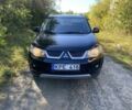 Черный Мицубиси Аутлендер, объемом двигателя 2 л и пробегом 350 тыс. км за 4500 $, фото 1 на Automoto.ua