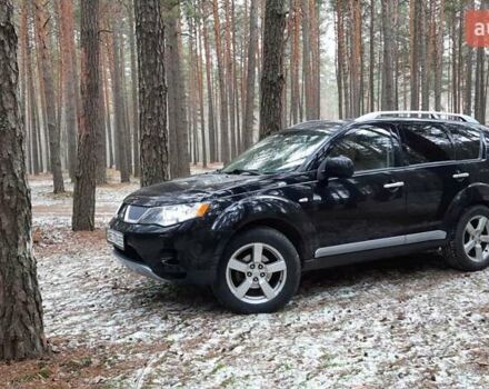 Черный Мицубиси Аутлендер, объемом двигателя 2.4 л и пробегом 228 тыс. км за 10400 $, фото 2 на Automoto.ua