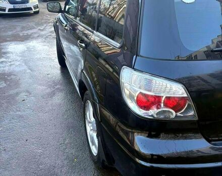 Черный Мицубиси Аутлендер, объемом двигателя 2.4 л и пробегом 231 тыс. км за 8500 $, фото 2 на Automoto.ua
