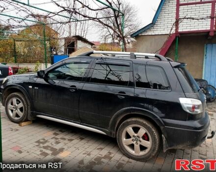 Черный Мицубиси Аутлендер, объемом двигателя 2 л и пробегом 280 тыс. км за 5800 $, фото 2 на Automoto.ua