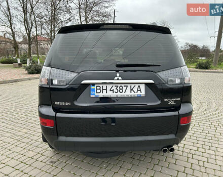 Черный Мицубиси Аутлендер, объемом двигателя 3 л и пробегом 77 тыс. км за 11800 $, фото 3 на Automoto.ua