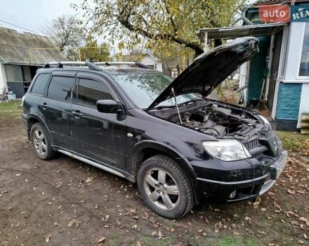 Чорний Міцубісі Аутлендер, об'ємом двигуна 2.38 л та пробігом 149 тис. км за 8800 $, фото 4 на Automoto.ua