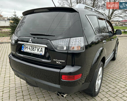 Черный Мицубиси Аутлендер, объемом двигателя 3 л и пробегом 77 тыс. км за 11800 $, фото 2 на Automoto.ua