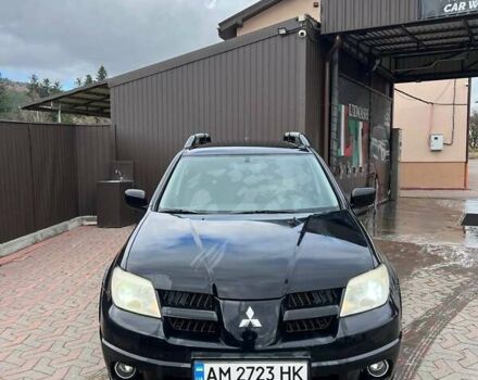 Черный Мицубиси Аутлендер, объемом двигателя 2.38 л и пробегом 220 тыс. км за 7500 $, фото 1 на Automoto.ua
