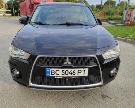 Черный Мицубиси Аутлендер, объемом двигателя 2 л и пробегом 104 тыс. км за 9900 $, фото 1 на Automoto.ua