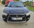 Черный Мицубиси Аутлендер, объемом двигателя 2 л и пробегом 104 тыс. км за 9900 $, фото 1 на Automoto.ua