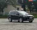 Черный Мицубиси Аутлендер, объемом двигателя 2.4 л и пробегом 233 тыс. км за 9800 $, фото 1 на Automoto.ua