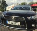 Чорний Міцубісі Аутлендер, об'ємом двигуна 2 л та пробігом 310 тис. км за 9800 $, фото 1 на Automoto.ua