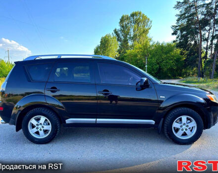Чорний Міцубісі Аутлендер, об'ємом двигуна 2.4 л та пробігом 171 тис. км за 8999 $, фото 3 на Automoto.ua
