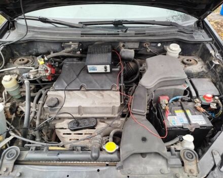 Черный Мицубиси Аутлендер, объемом двигателя 2.4 л и пробегом 149 тыс. км за 8800 $, фото 6 на Automoto.ua