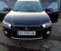 Чорний Міцубісі Аутлендер, об'ємом двигуна 2 л та пробігом 210 тис. км за 9700 $, фото 1 на Automoto.ua
