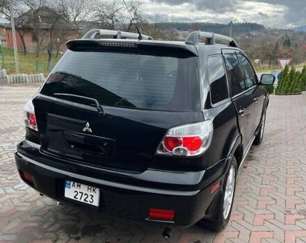 Черный Мицубиси Аутлендер, объемом двигателя 2.38 л и пробегом 220 тыс. км за 7500 $, фото 4 на Automoto.ua