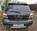 Черный Мицубиси Аутлендер, объемом двигателя 2.4 л и пробегом 149 тыс. км за 8800 $, фото 3 на Automoto.ua