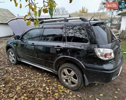 Чорний Міцубісі Аутлендер, об'ємом двигуна 2.38 л та пробігом 149 тис. км за 8800 $, фото 2 на Automoto.ua