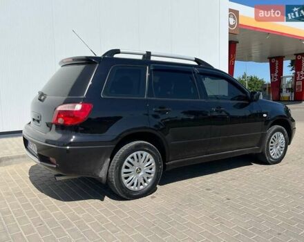 Черный Мицубиси Аутлендер, объемом двигателя 2 л и пробегом 236 тыс. км за 6699 $, фото 7 на Automoto.ua