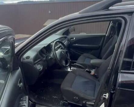 Черный Мицубиси Аутлендер, объемом двигателя 2.38 л и пробегом 220 тыс. км за 7500 $, фото 7 на Automoto.ua