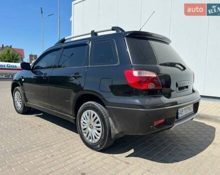 Черный Мицубиси Аутлендер, объемом двигателя 2 л и пробегом 236 тыс. км за 6699 $, фото 2 на Automoto.ua