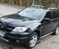 Чорний Міцубісі Аутлендер, об'ємом двигуна 2 л та пробігом 160 тис. км за 8500 $, фото 1 на Automoto.ua