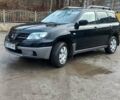 Черный Мицубиси Аутлендер, объемом двигателя 2 л и пробегом 73 тыс. км за 9500 $, фото 3 на Automoto.ua