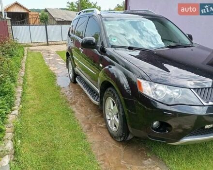 Черный Мицубиси Аутлендер, объемом двигателя 2.2 л и пробегом 279 тыс. км за 11000 $, фото 2 на Automoto.ua