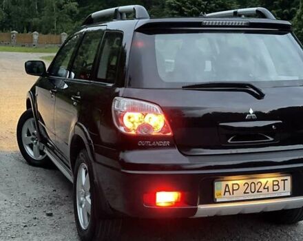 Чорний Міцубісі Аутлендер, об'ємом двигуна 2 л та пробігом 79 тис. км за 9500 $, фото 160 на Automoto.ua