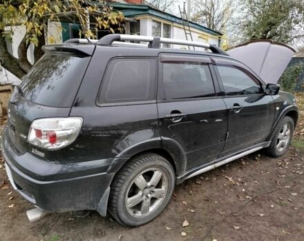 Черный Мицубиси Аутлендер, объемом двигателя 2.4 л и пробегом 149 тыс. км за 8800 $, фото 4 на Automoto.ua