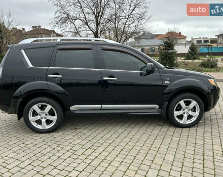 Черный Мицубиси Аутлендер, объемом двигателя 3 л и пробегом 77 тыс. км за 11800 $, фото 1 на Automoto.ua