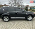 Черный Мицубиси Аутлендер, объемом двигателя 3 л и пробегом 77 тыс. км за 11800 $, фото 1 на Automoto.ua