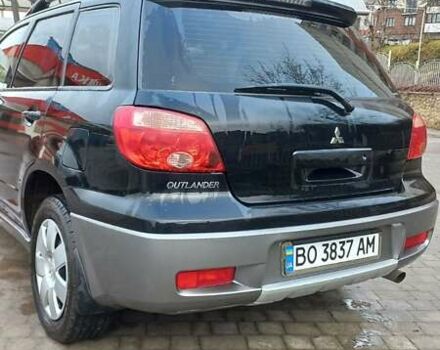 Черный Мицубиси Аутлендер, объемом двигателя 2 л и пробегом 73 тыс. км за 9500 $, фото 7 на Automoto.ua