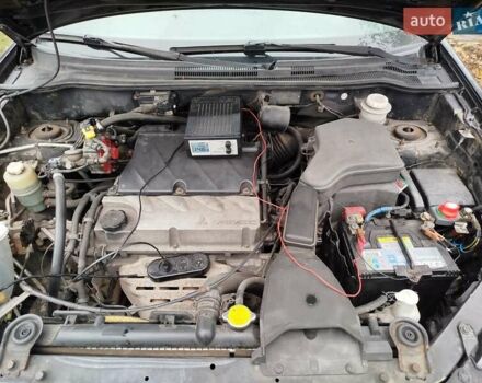 Чорний Міцубісі Аутлендер, об'ємом двигуна 2.38 л та пробігом 149 тис. км за 8800 $, фото 6 на Automoto.ua