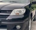 Чорний Міцубісі Аутлендер, об'ємом двигуна 2 л та пробігом 79 тис. км за 9500 $, фото 43 на Automoto.ua