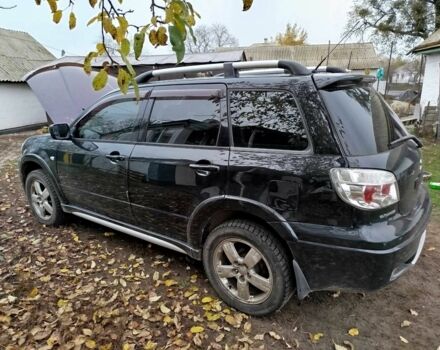 Черный Мицубиси Аутлендер, объемом двигателя 2.4 л и пробегом 149 тыс. км за 8800 $, фото 2 на Automoto.ua