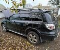 Черный Мицубиси Аутлендер, объемом двигателя 2.4 л и пробегом 149 тыс. км за 8800 $, фото 2 на Automoto.ua