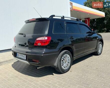 Черный Мицубиси Аутлендер, объемом двигателя 2 л и пробегом 236 тыс. км за 6699 $, фото 6 на Automoto.ua
