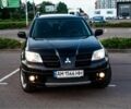 Черный Мицубиси Аутлендер, объемом двигателя 2 л и пробегом 190 тыс. км за 8800 $, фото 1 на Automoto.ua