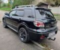 Черный Мицубиси Аутлендер, объемом двигателя 2 л и пробегом 223 тыс. км за 7200 $, фото 6 на Automoto.ua