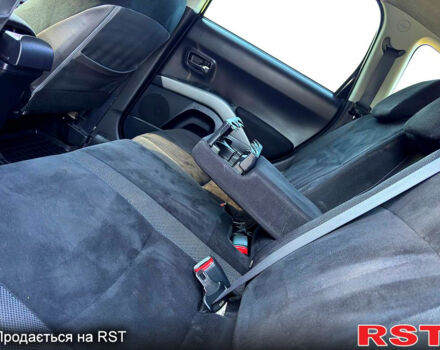 Чорний Міцубісі Аутлендер, об'ємом двигуна 2.4 л та пробігом 171 тис. км за 8999 $, фото 9 на Automoto.ua