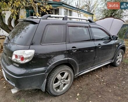 Чорний Міцубісі Аутлендер, об'ємом двигуна 2.38 л та пробігом 149 тис. км за 8800 $, фото 3 на Automoto.ua