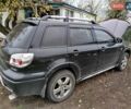 Чорний Міцубісі Аутлендер, об'ємом двигуна 2.38 л та пробігом 149 тис. км за 8800 $, фото 3 на Automoto.ua