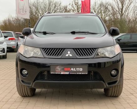 Черный Мицубиси Аутлендер, объемом двигателя 2.4 л и пробегом 175 тыс. км за 10499 $, фото 1 на Automoto.ua