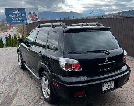 Черный Мицубиси Аутлендер, объемом двигателя 2.38 л и пробегом 220 тыс. км за 7500 $, фото 5 на Automoto.ua