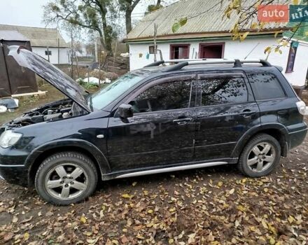 Чорний Міцубісі Аутлендер, об'ємом двигуна 2.38 л та пробігом 149 тис. км за 8800 $, фото 1 на Automoto.ua