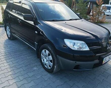 Черный Мицубиси Аутлендер, объемом двигателя 2 л и пробегом 235 тыс. км за 6900 $, фото 1 на Automoto.ua