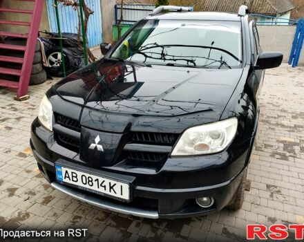 Черный Мицубиси Аутлендер, объемом двигателя 2 л и пробегом 280 тыс. км за 5800 $, фото 1 на Automoto.ua