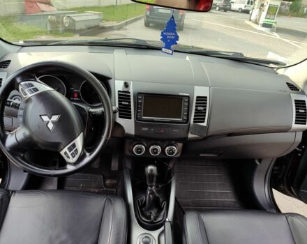 Черный Мицубиси Аутлендер, объемом двигателя 2 л и пробегом 104 тыс. км за 9900 $, фото 2 на Automoto.ua